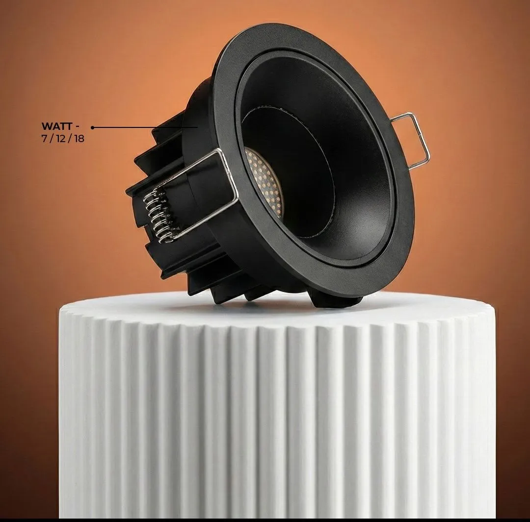 Black recessed downlight with a deep anti-glare reflector and finned heatsink